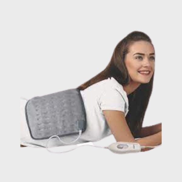 A woman is wearing Tynor Heating Pad Ortho I-73 Extra large
